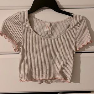 A slightly used light pink crop top that can fit in any casual occasion.